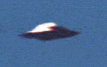 On August 4, 1990, two hikers near Calvine in Scotland took a photograph of a mysterious, diamond-shaped flying object hovering in the middle of the sky.